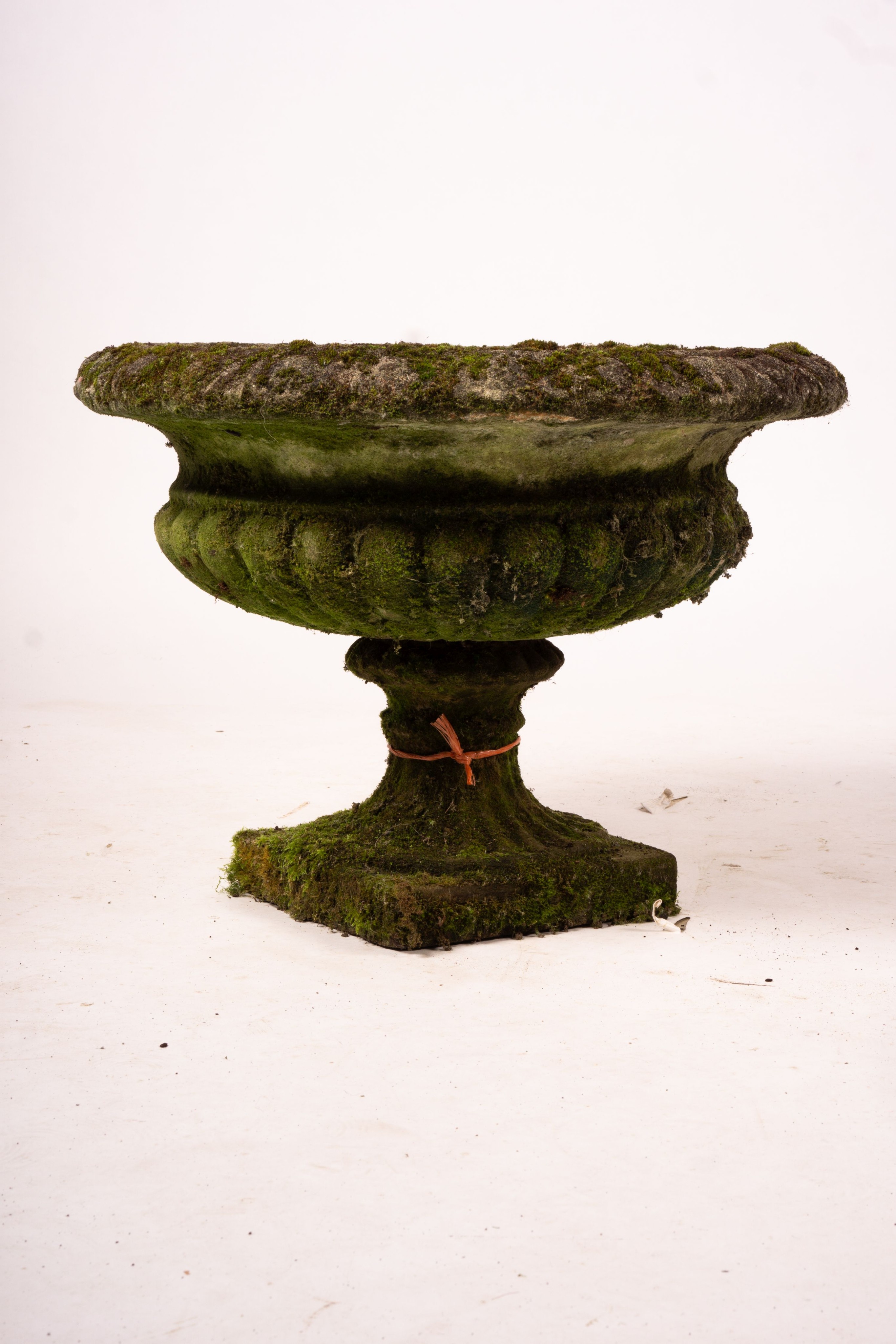 A pair of weathered reconstituted stone campana garden urns, Diam.56cm H.42cm